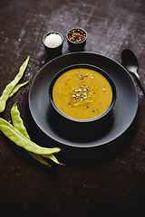 Image showing Creamy soup with green pea in a ceramic white plate