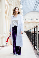 Image showing Beautiful middle-aged woman with shopping bags