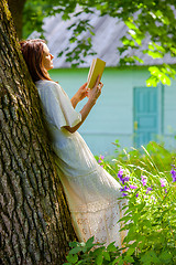 Image showing beautiful woman reading a book