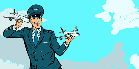 Image showing male airplane pilot. Model aircraft in hand