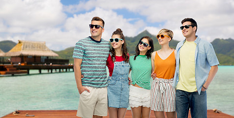 Image showing friends in sunglasses over bora bora background