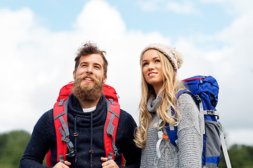 Image showing couple of travelers with backpacks hiking