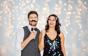 Image showing happy couple with party props having fun