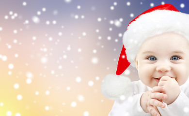 Image showing little baby boy in santa hat on christmas