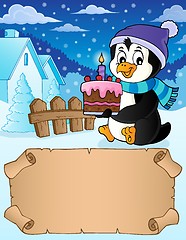 Image showing Small parchment and penguin with cake