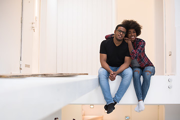 Image showing couple having break during moving to new house