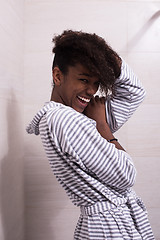 Image showing beautiful black woman wearing  bathrobe