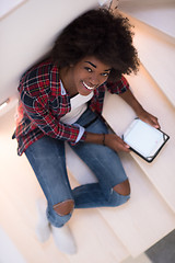 Image showing black woman using her electronic tablet