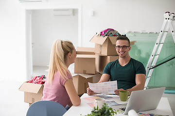 Image showing Young couple moving in a new home