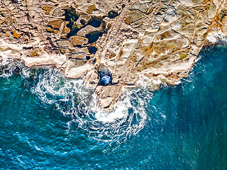 Image showing Rocks, rockpools and ocean swirls