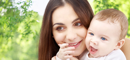 Image showing mother with baby over green natural background