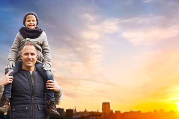 Image showing happy father and son over sunset in tallinn city