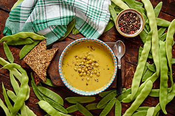 Image showing Green pea cream soup in grey bowl