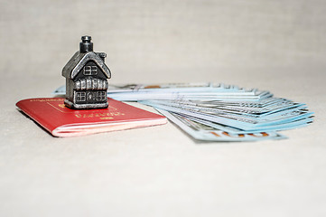 Image showing Passport, money and home - the concept of buying a property