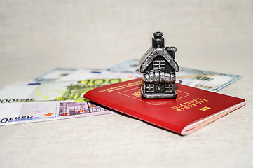 Image showing Passport, money and home - the concept of buying a property