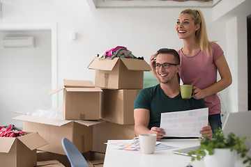 Image showing Young couple moving in a new home