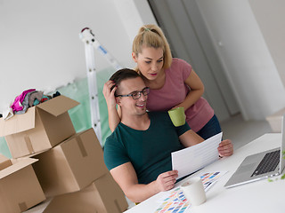 Image showing Young couple moving in a new home