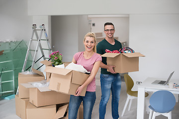 Image showing young couple moving into a new home