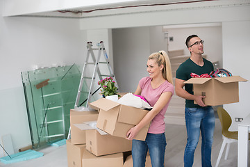 Image showing young couple moving into a new home