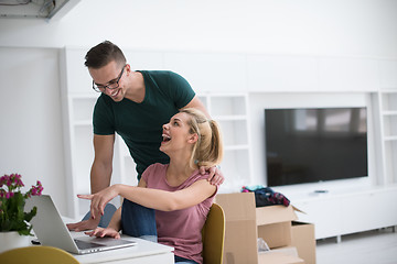 Image showing Young couple moving in a new home