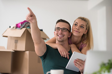 Image showing Young couple moving in a new home