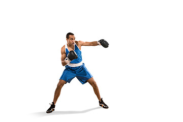 Image showing Sporty man during boxing exercise. Photo of boxer on white background