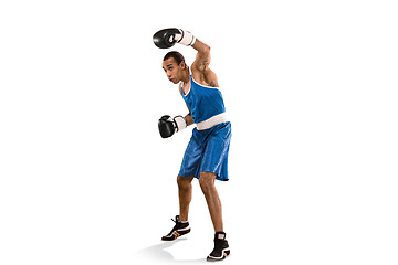 Image showing Sporty man during boxing exercise. Photo of boxer on white background