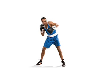 Image showing Sporty man during boxing exercise. Photo of boxer on white background