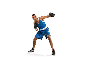 Image showing Sporty man during boxing exercise. Photo of boxer on white background