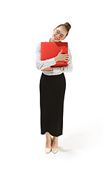 Image showing Full length portrait of a smiling female teacher holding a laptop isolated against white background