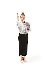 Image showing Full length portrait of a female teacher holding a folder isolated against white background