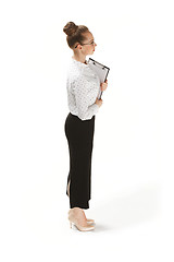 Image showing Full length portrait of female teacher holding a folder isolated against white background