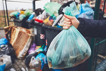 Image showing Full trash cans with rubbish bags