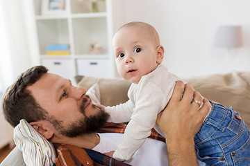 Image showing happy father with little baby boy at home