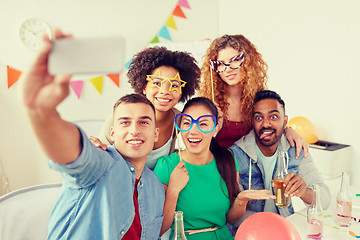 Image showing happy team taking selfie at office party