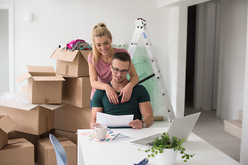 Image showing Young couple moving in a new home