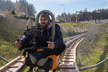 Image showing videographer at work on alpine coaster