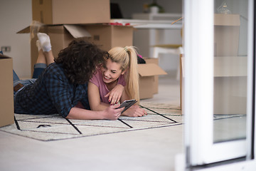 Image showing Young couple moving in a new flat