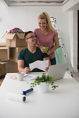 Image showing Young couple moving in a new home