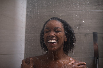 Image showing African American woman in the shower