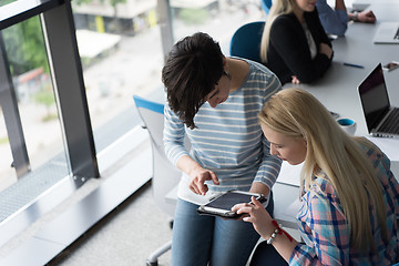 Image showing Pretty Businesswomen Using Tablet In Office Building during conf