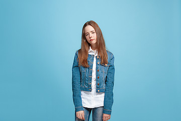 Image showing Young serious thoughtful teen girl. Doubt concept.