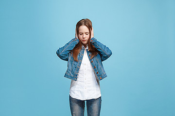 Image showing Beautiful woman in stress isolated on blue