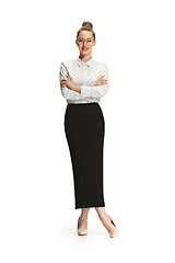 Image showing Full length portrait of a smiling female teacher isolated against white background