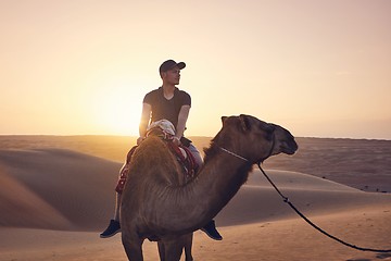 Image showing Camel riding in desert