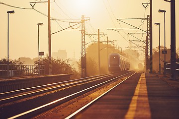 Image showing Passenger train at sunrise.