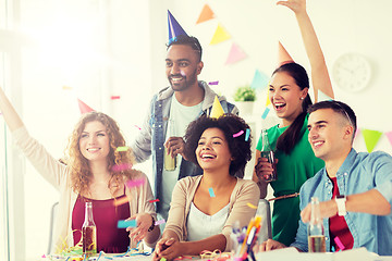 Image showing happy team with confetti at office birthday party