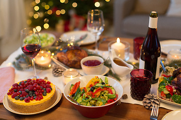 Image showing food and drinks on christmas table at home