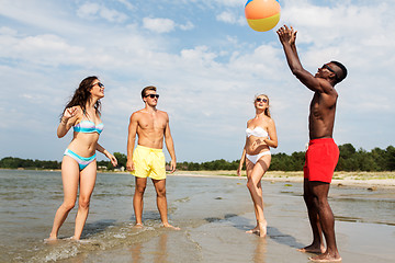 Image showing friends playing with beach ball in summer