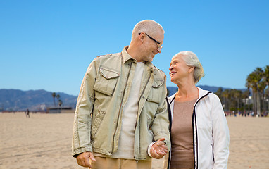 Image showing happy senior couple over venice beach background